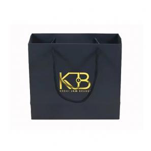 Black gift bags with golden foil stamp logo 