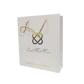 Boutique shopping white paper bags with foil ogo 